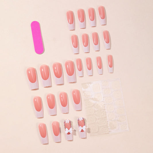 White Coffin French Bow Floral 3D press-on nails — worn on both hands, full look