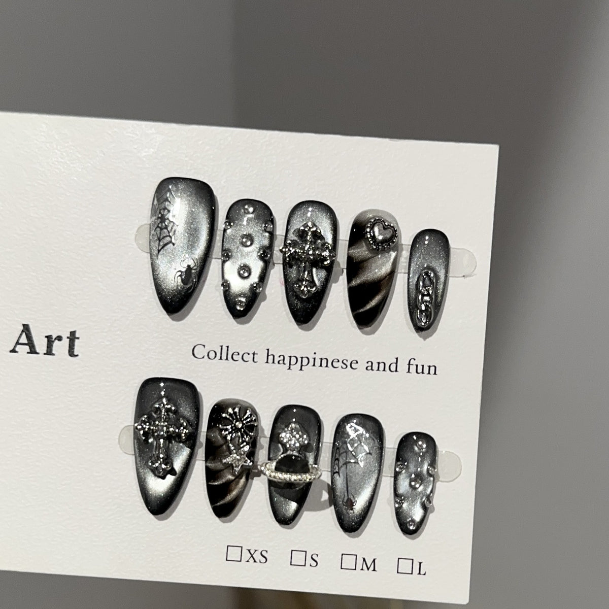 Dark Realm Spirit Almond Cat Eye press-on nails — worn on hand, close-up