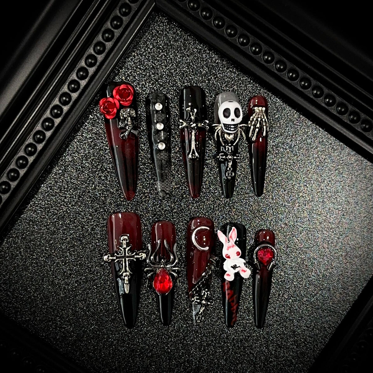 Blood Sacrifice Long Stiletto Halloween press-on nails — full set in 12 sizes, laid out flat