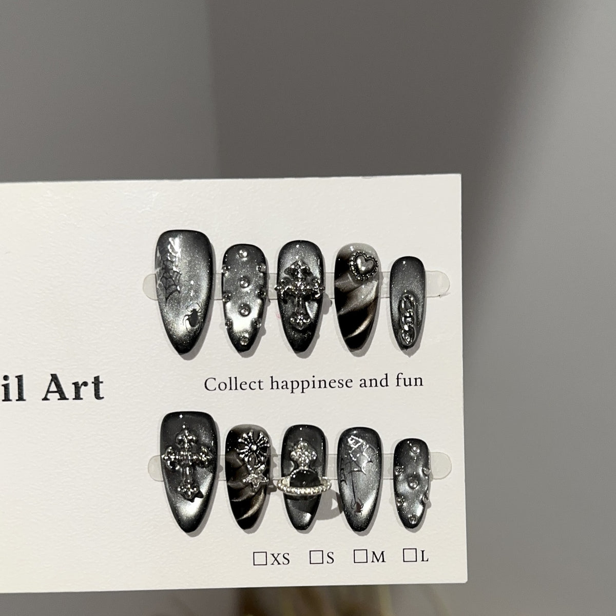 Dark Realm Spirit Almond Cat Eye press-on nails — full set in 12 sizes, laid out flat