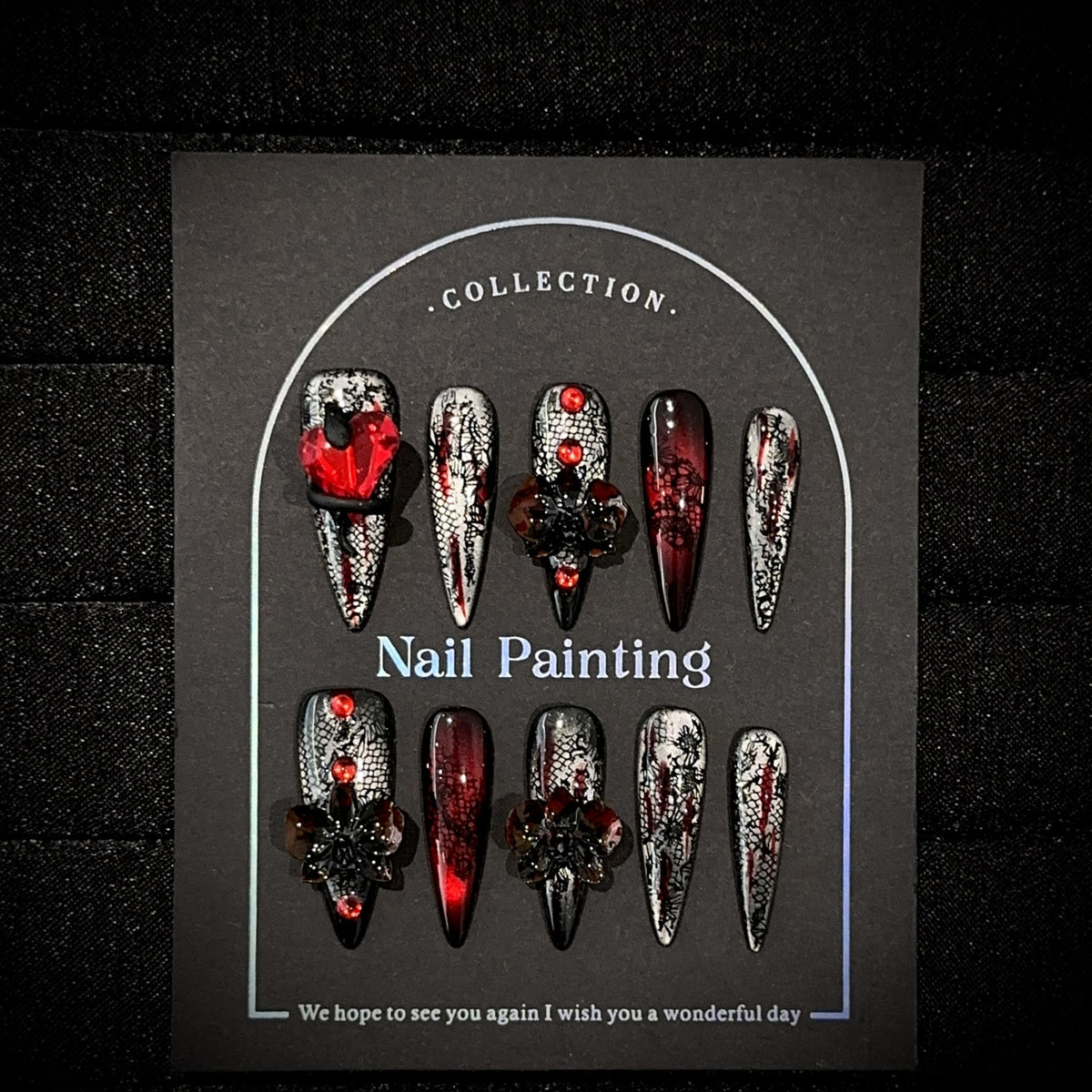 Blood Butterfly Long Stiletto Cat Eye press-on nails — full set in 12 sizes, laid out flat