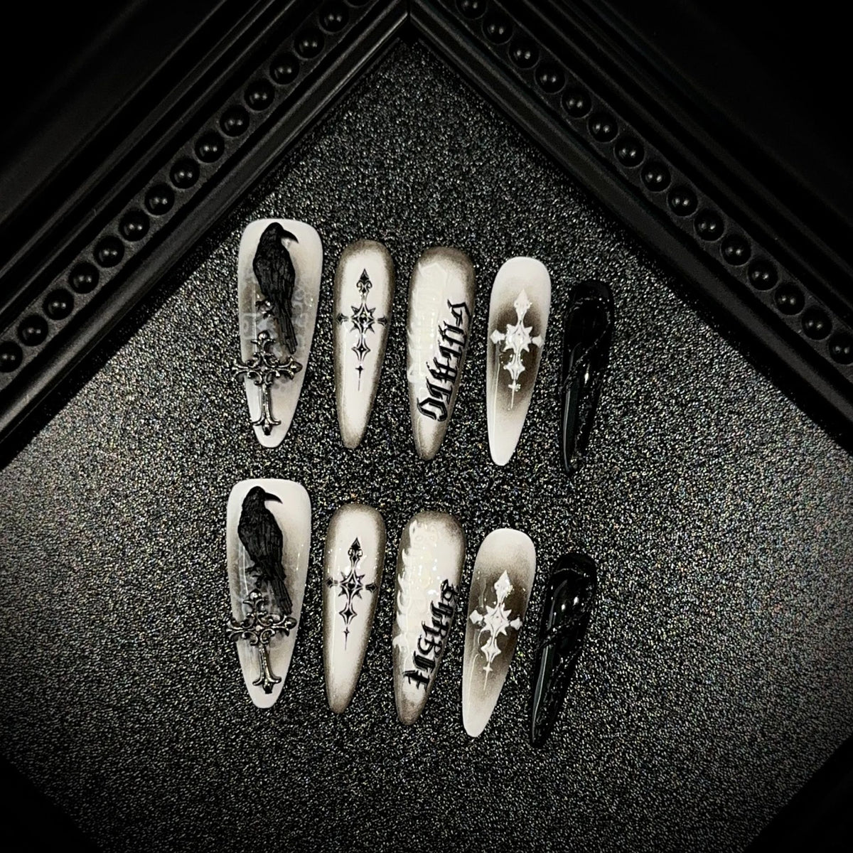 Black Raven Oath Long Stiletto Halloween press-on nails — full set in 12 sizes, laid out flat
