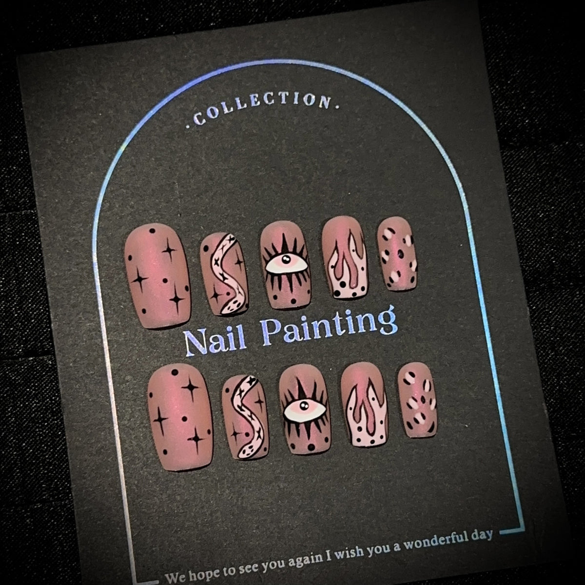 Aurora Pink Snake Medium Square press-on nails in almond — worn on hand, close-up
