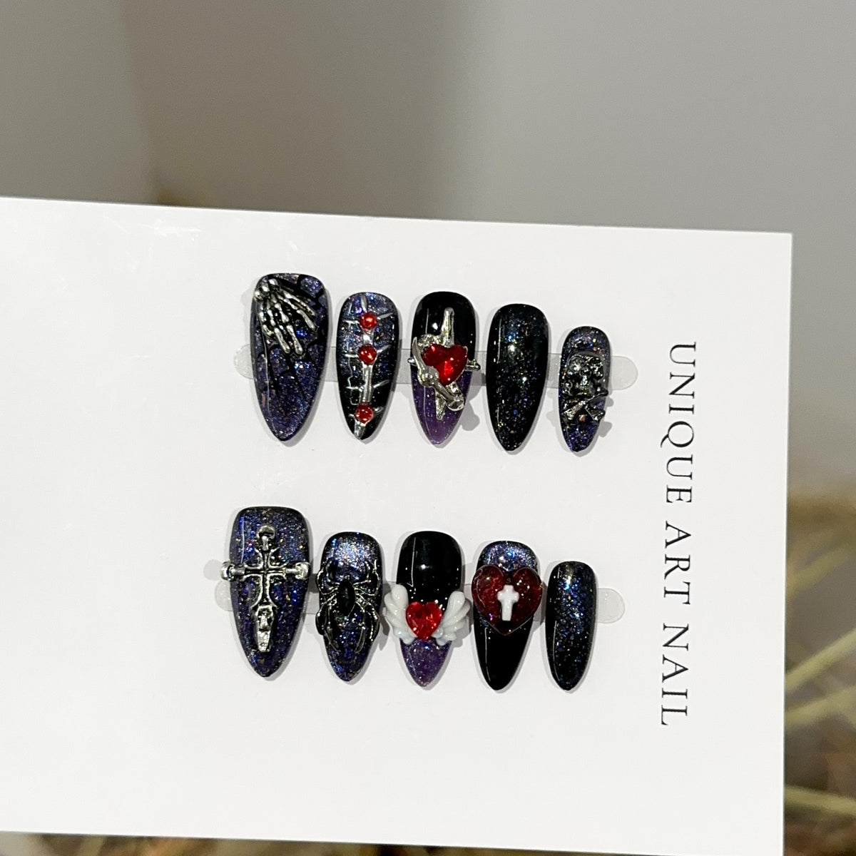 Spider Web Heart Almond Halloween press-on nails — full set in 12 sizes, laid out flat