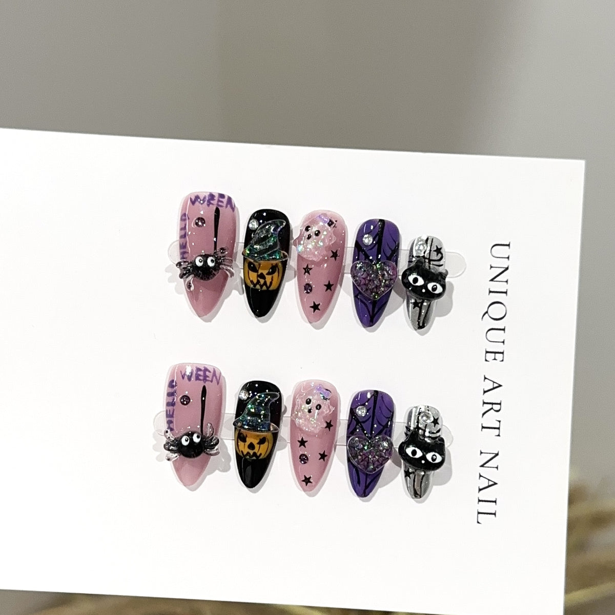 Halloween Carnival Almond press-on nails — full set in 12 sizes, laid out flat