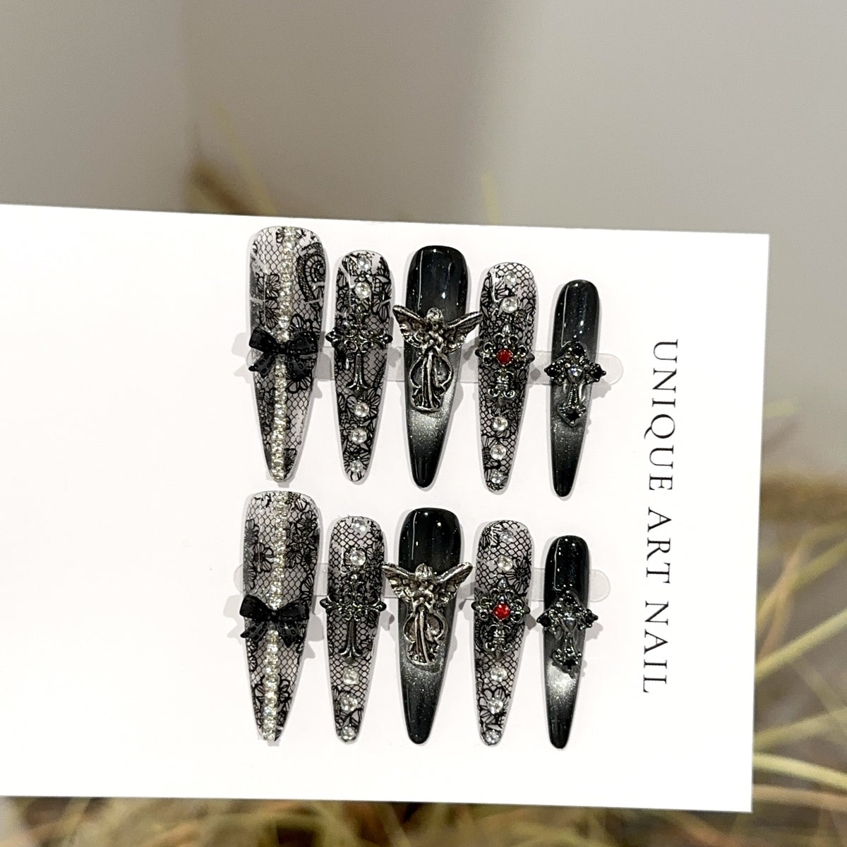 Fallen Angel Long Stiletto Gothic — packaging with nail file, jelly tabs and glue
