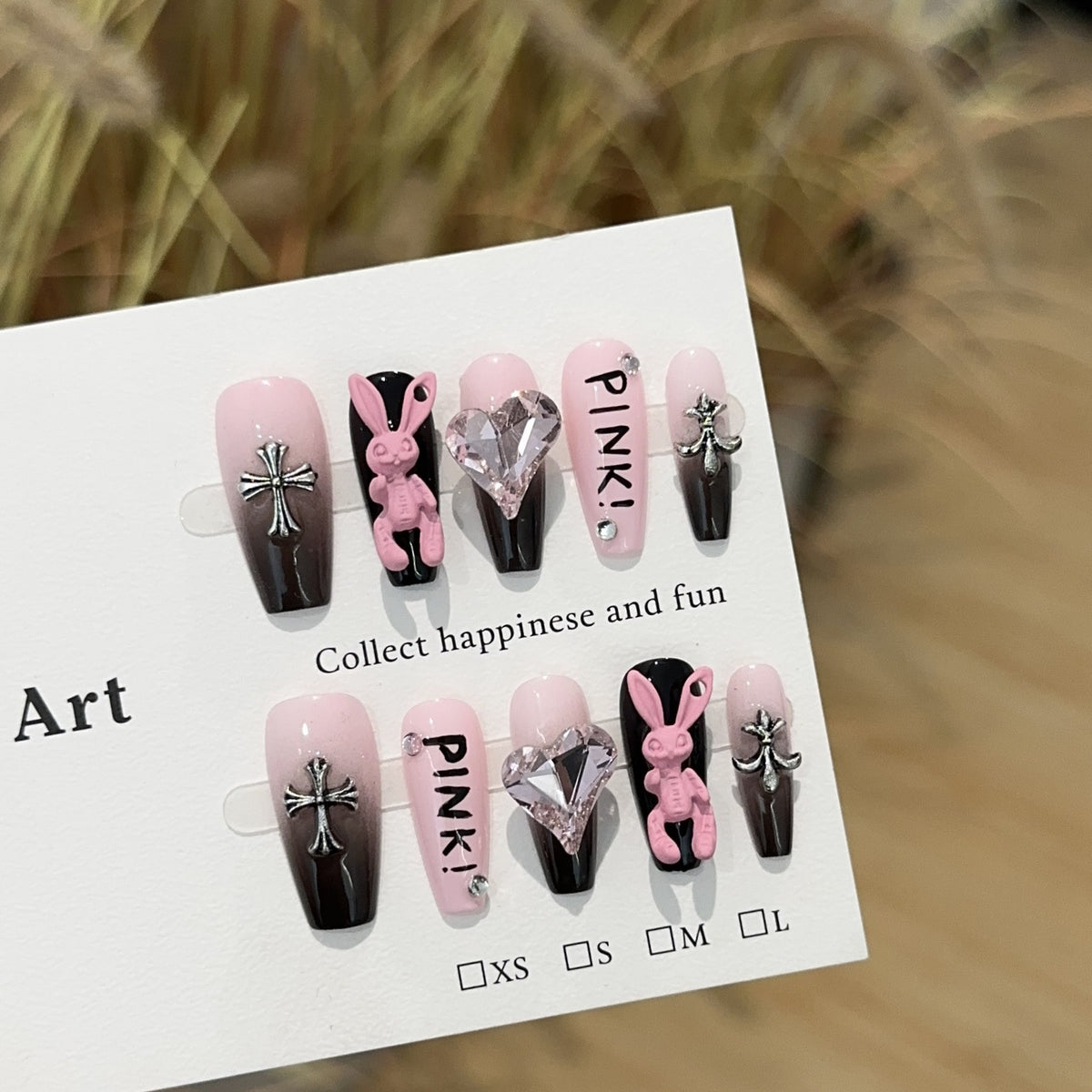 Pink Bunny Girl Medium Coffin press-on nails — worn on hand, close-up