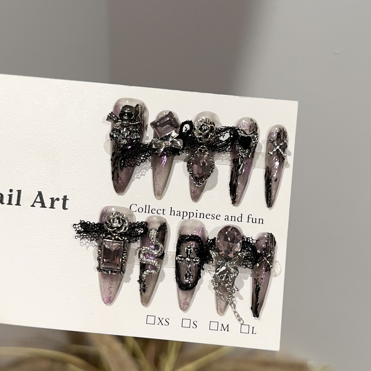 Magic Castle Long Stiletto Halloween press-on nails in almond — worn on both hands, full look