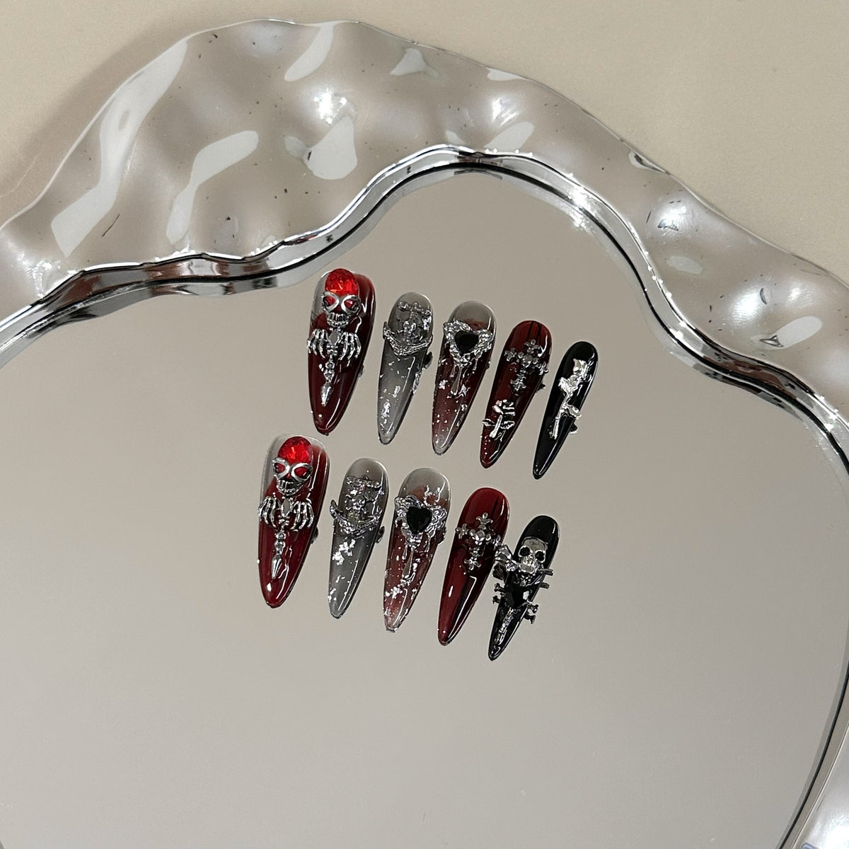 Blood Rose Long Stiletto press-on nails — full set in 12 sizes, laid out flat