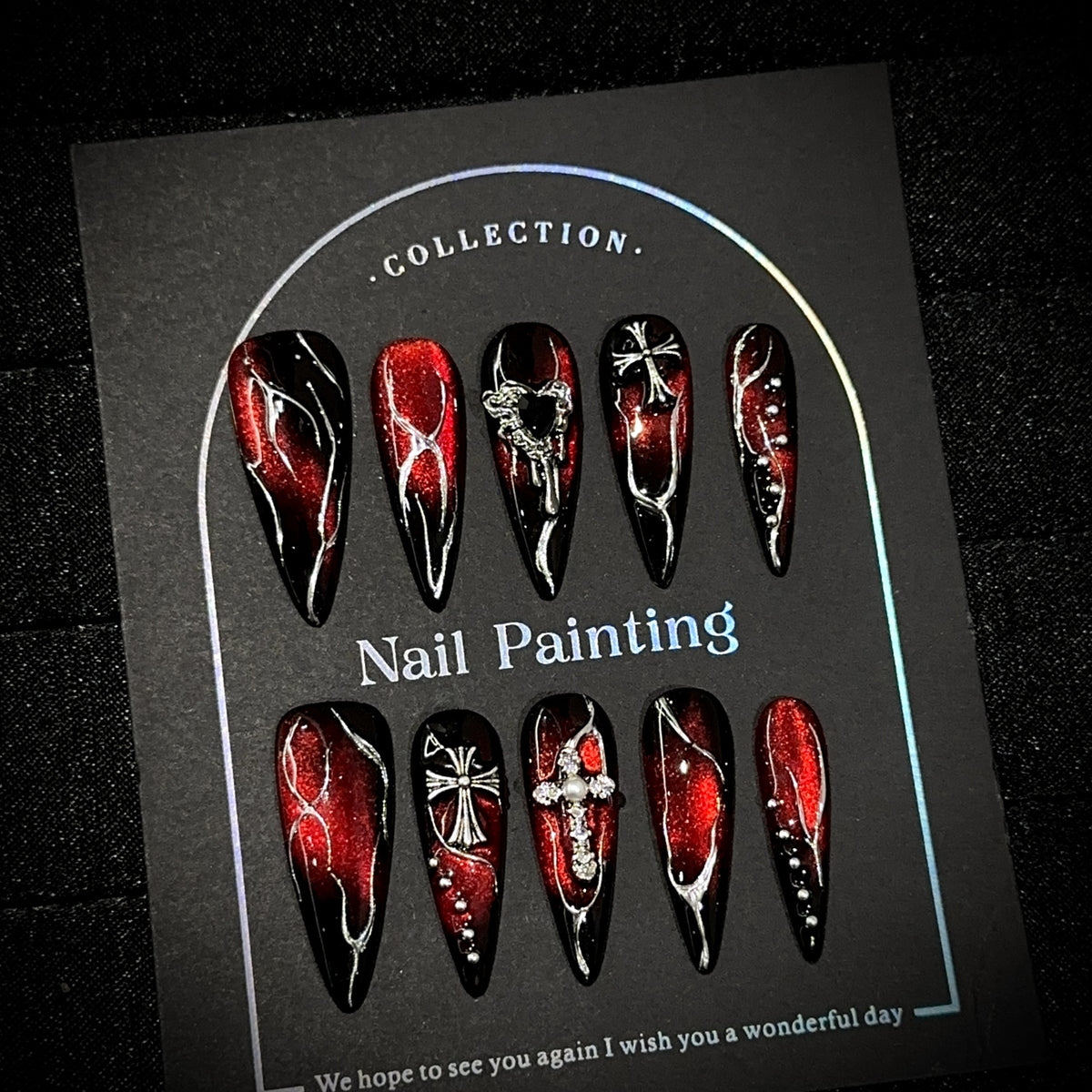 Bloody Heart Long Stiletto Halloween press-on nails in almond — worn on hand, close-up