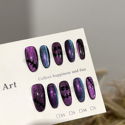 Ghost Face Medium Oval Halloween press-on nails in almond — worn on hand, close-up