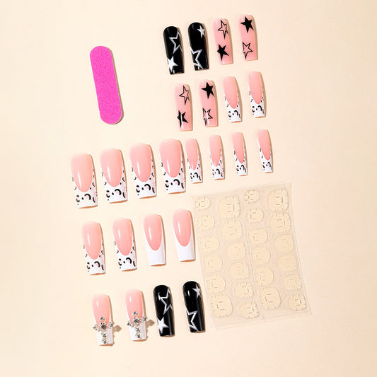 Coffin French Leopard Stars Cross press-on nails — worn on both hands, full look