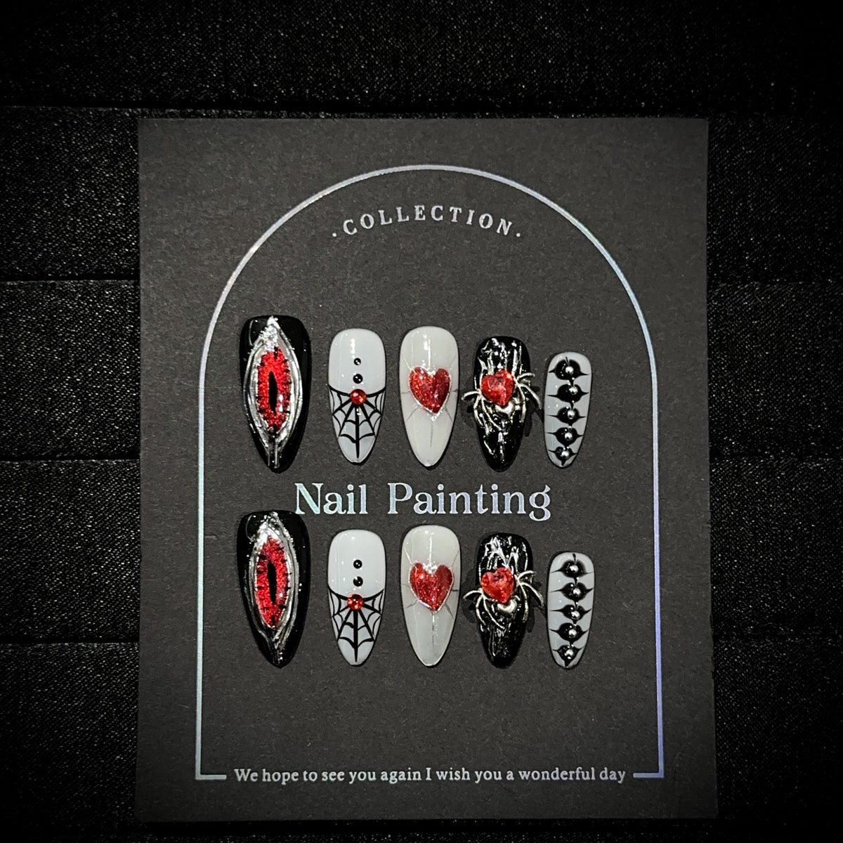 Hell's Eye Almond Halloween press-on nails — worn on both hands, full look