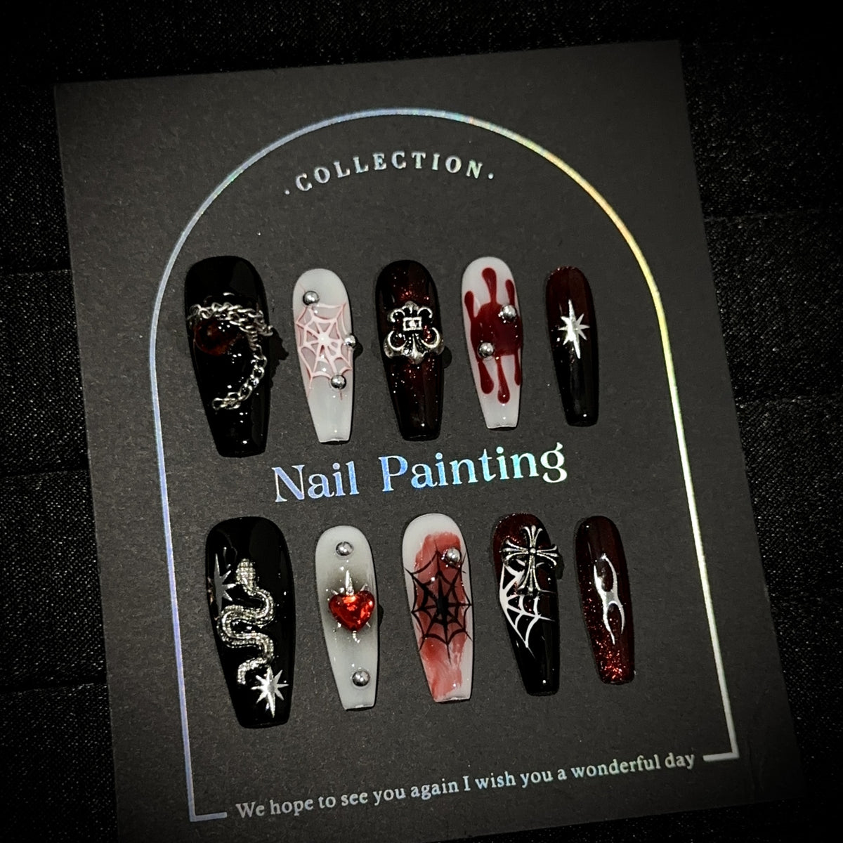 Crimson Night Web Long Coffin Halloween press-on nails — worn on hand, close-up