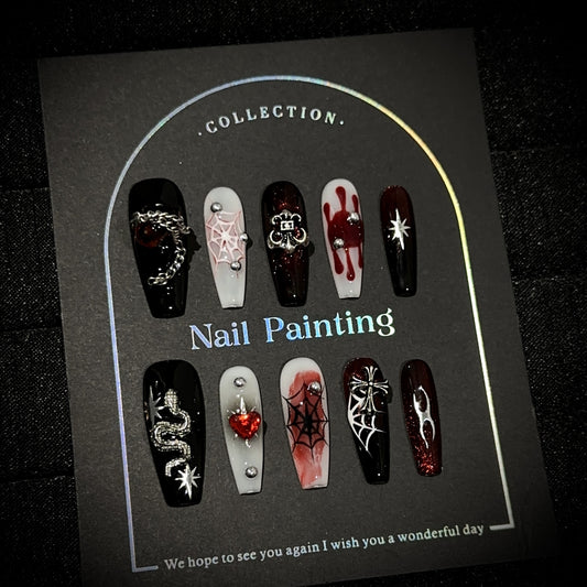 Crimson Night Web Long Coffin Halloween press-on nails — worn on hand, close-up