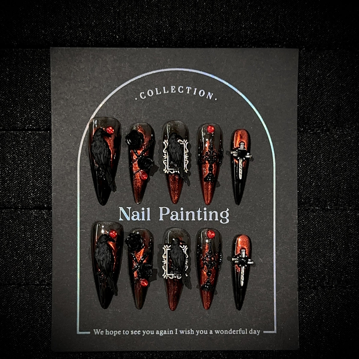 Raven Song Long Stiletto Halloween press-on nails — full set in 12 sizes, laid out flat