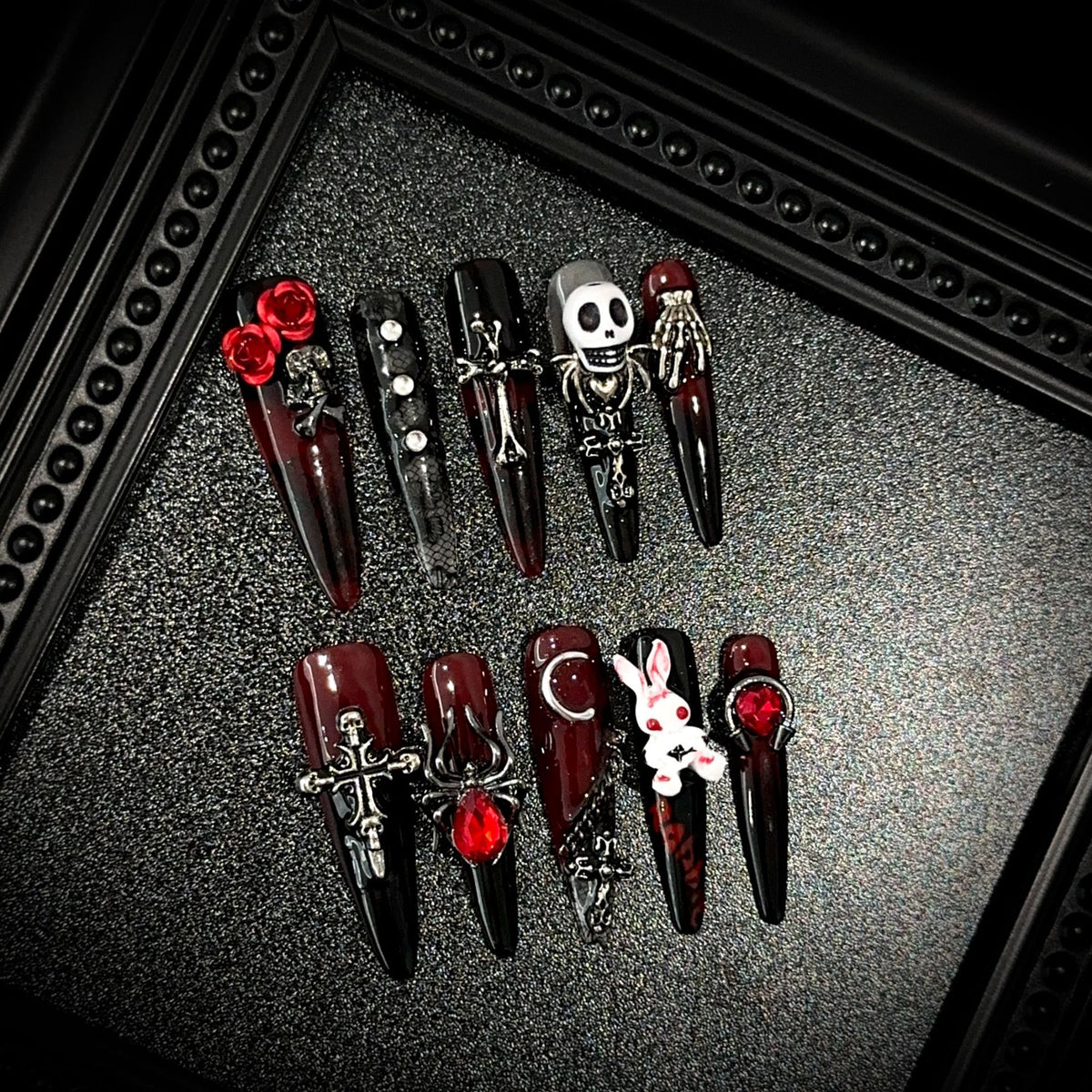 Blood Sacrifice Long Stiletto Halloween press-on nails in almond — worn on both hands, full look
