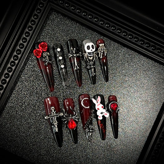 Blood Sacrifice Long Stiletto Halloween press-on nails in almond — worn on both hands, full look