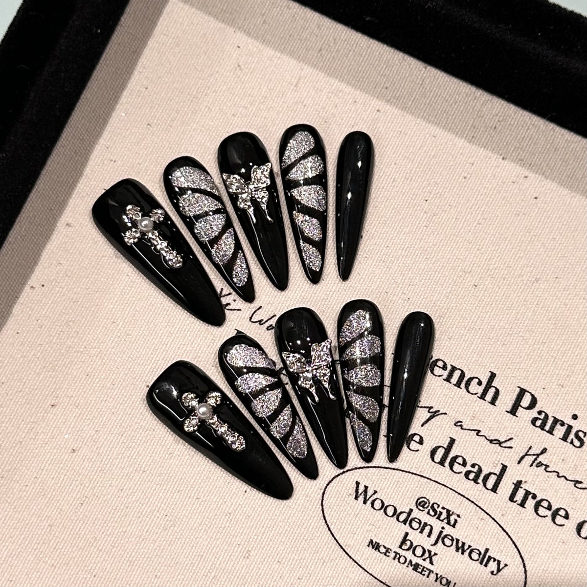 Break Free Long Stiletto Cat Eye press-on nails in almond — worn on both hands, full look