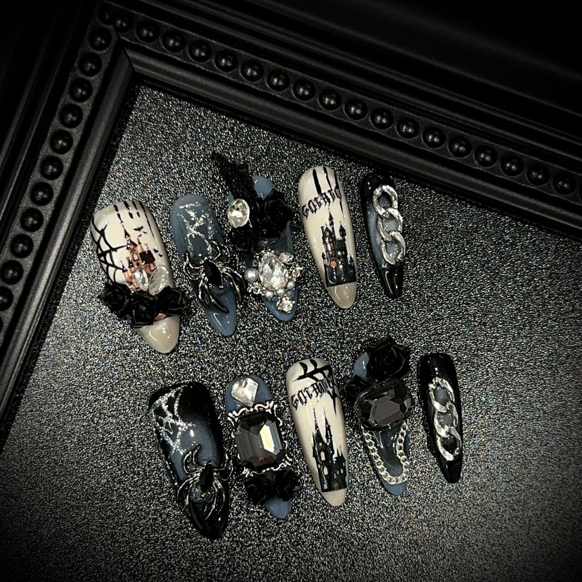 Dark Manor Long Oval Halloween press-on nails — full set in 12 sizes, laid out flat