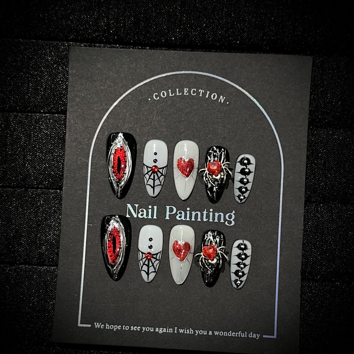 Hell's Eye Almond Halloween press-on nails — full set in 12 sizes, laid out flat