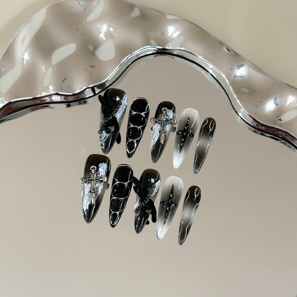 Misty Forest Long Stiletto press-on nails in almond — worn on hand, close-up
