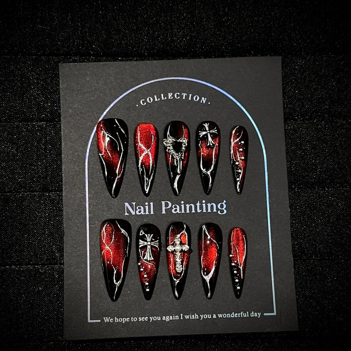 Bloody Heart Long Stiletto Halloween press-on nails in almond — worn on both hands, full look