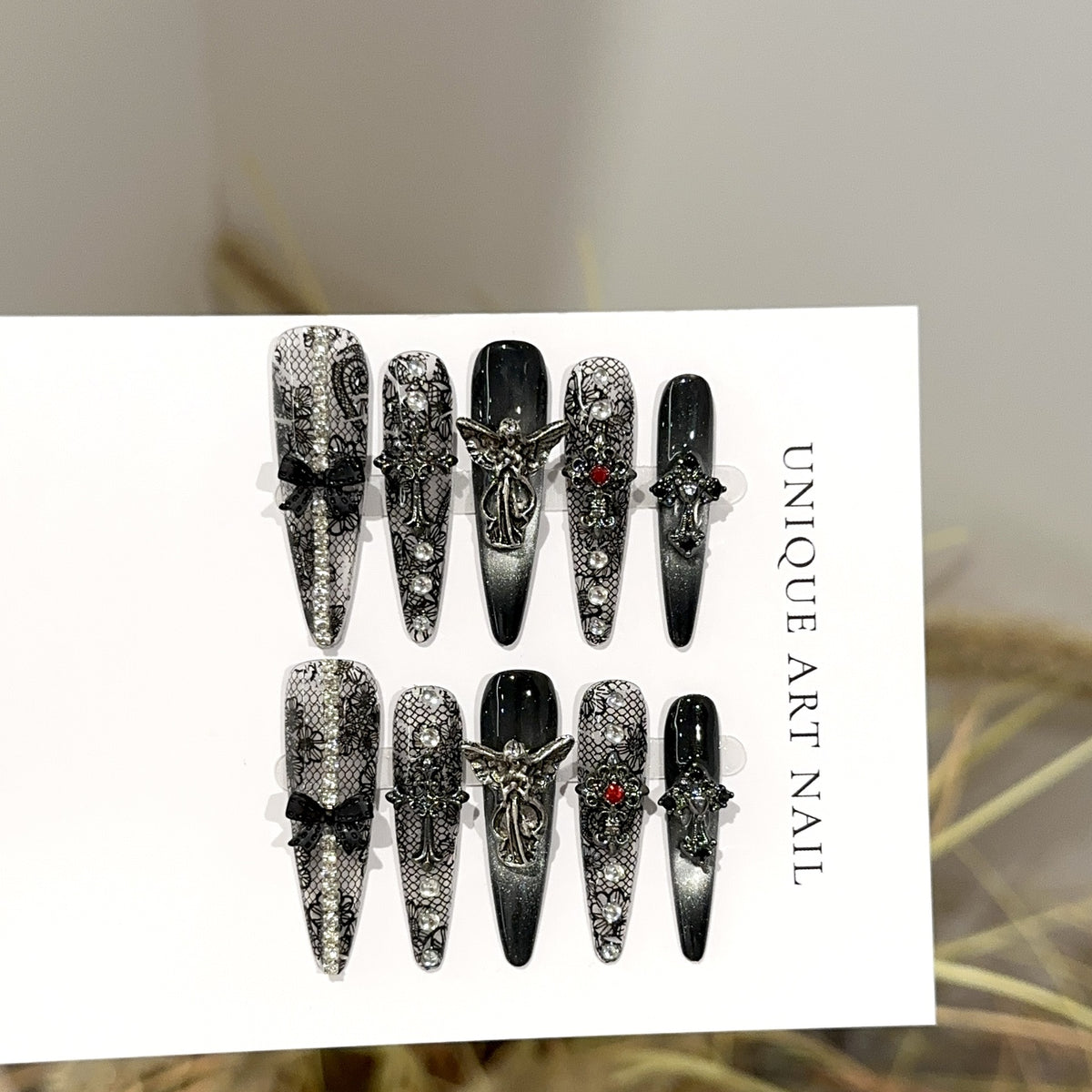 Fallen Angel Long Stiletto Gothic press-on nails — full set in 12 sizes, laid out flat