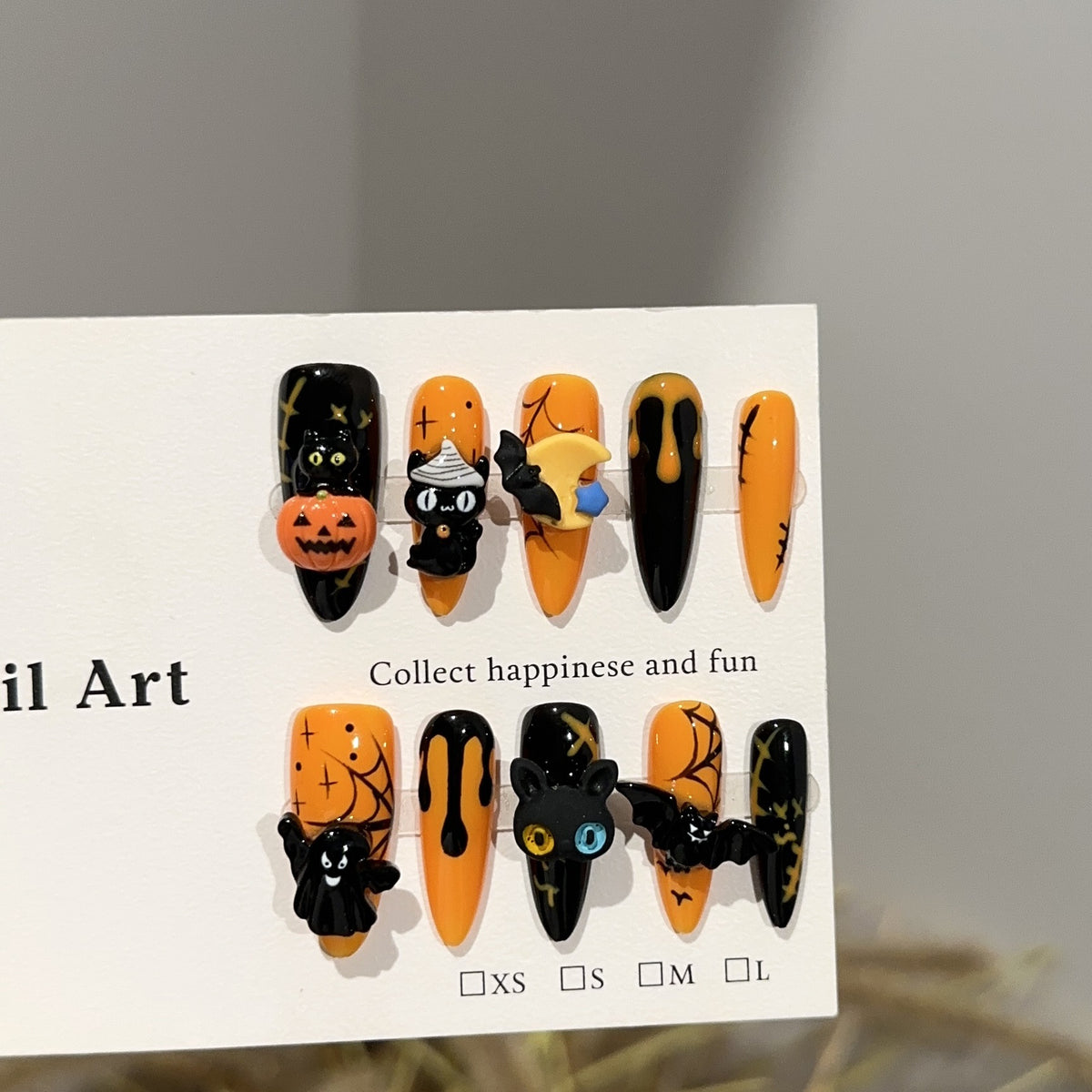 Spooky Pumpkin Long Oval Halloween press-on nails — full set in 12 sizes, laid out flat