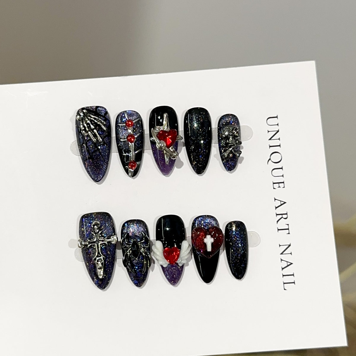 Spider Web Heart Almond Halloween press-on nails — worn on hand, close-up