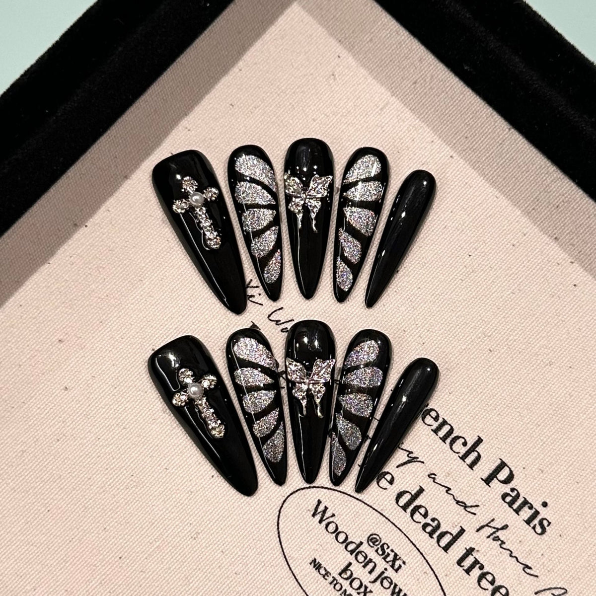Break Free Long Stiletto Cat Eye press-on nails in almond — worn on hand, close-up