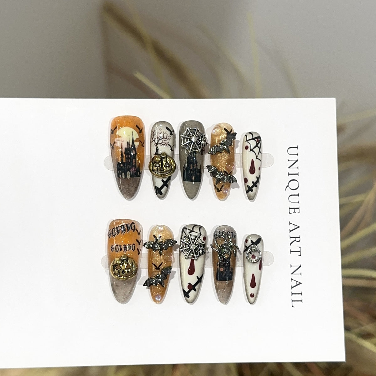 Bat Attack Long Oval Halloween press-on nails in almond — worn on both hands, full look