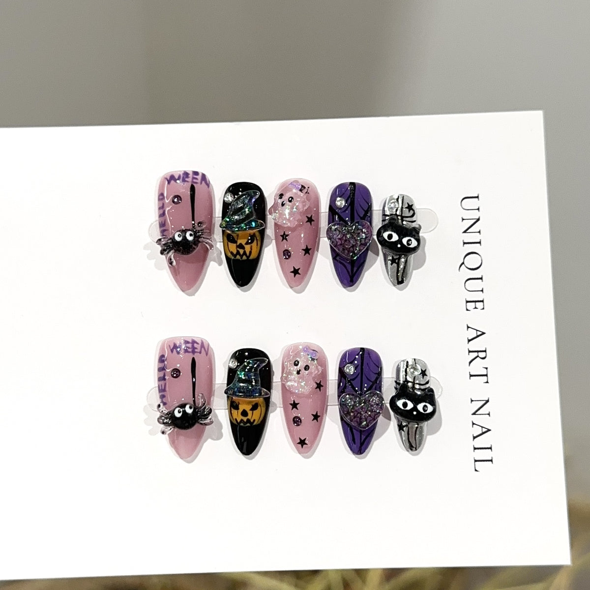 Halloween Carnival Almond press-on nails — worn on both hands, full look