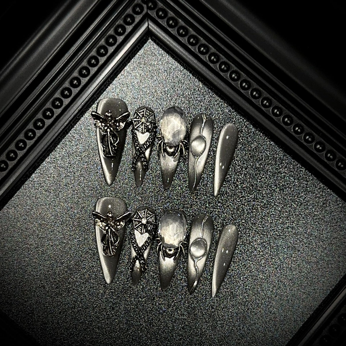 Divine Sacrifice Long Stiletto Cat Eye press-on nails — full set in 12 sizes, laid out flat
